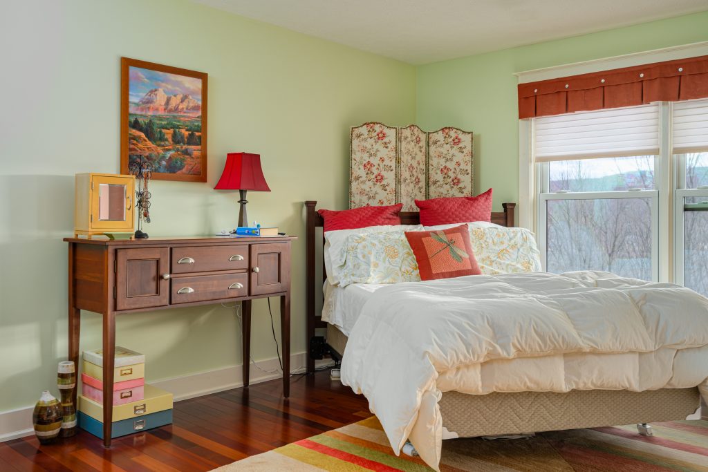 Real Estate Photograph of Main Bedroom in Home in Oneota NY Shot by New York Real Estate Photography
